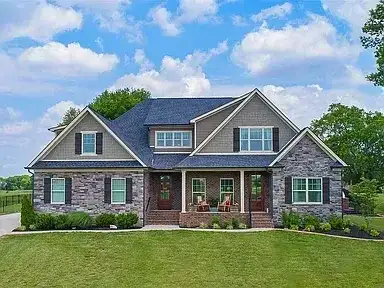 Craftsman Home Dark Roof Stone Facade project in Oklahoma City, OK