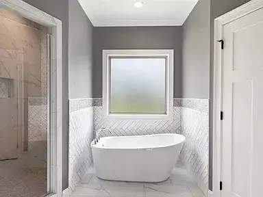Freestanding Tub Herringbone Tile Bathroom Remodel Okc project in Edmond, OK and the greater Oklahoma City metro