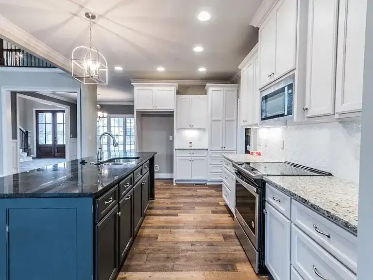 Kitchen Remodel Dark Island White Cabinets project in Oklahoma City, OK
