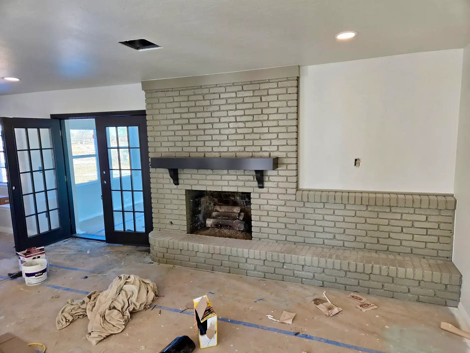 Living Room Remodel Painted Brick Fireplace project in Oklahoma City, OK